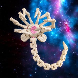 May include: A white articulated alien creature with a pink centre and a segmented tail. The creature is posed against a dark blue and purple space background.