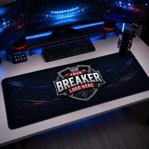 May include: A rectangular black desk mat featuring a central shield-shaped emblem with the text YOUR BREAKER LOGO HERE in white and red. The mat has a dark background with subtle blue light streaks and faint line art patterns of sports equipment.