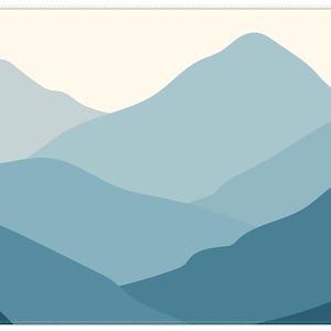 May include: A rectangular mat with a mountain range design in shades of blue and teal. The overlapping mountains create a layered effect against a cream sky. The text "Camper Style" is in the lower left corner.