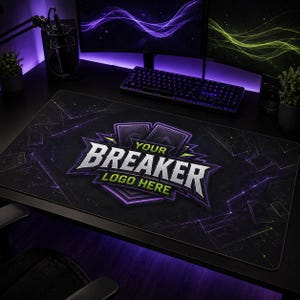 May include: A rectangular black desk mat featuring a central graphic with the text YOUR BREAKER LOGO HERE in white and green lettering. The design includes purple and black geometric card-like shapes and abstract lines across the surface.