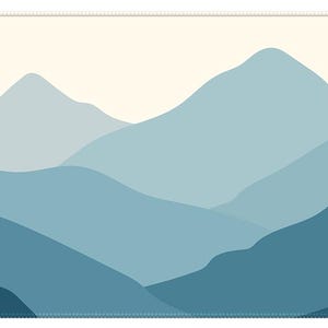 May include: A rectangular mousepad with a mountain range design in shades of blue. The image shows layers of mountains in different tones, set against a light beige sky. The words "CamperStylz" are in the lower left corner.