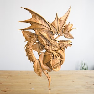 May include: A wooden carving of a dragon curled around a rose. The dragon has detailed scales and wings, and the rose is in full bloom. The carving is a beautiful example of craftsmanship.