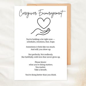 May include: A white card with the words "Caregiver Encouragement" in elegant script. The card features a line drawing of a heart held in cupped hands, with supportive text below. The card is inside a brown envelope.