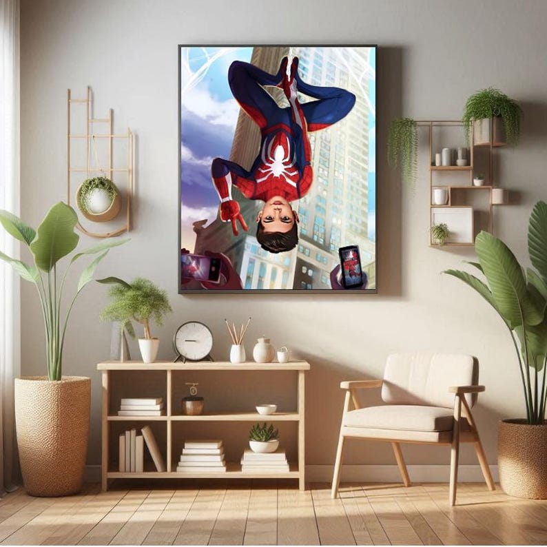 May include: A framed illustration of a superhero in a red and blue suit hanging upside down in front of a tall building. The superhero is holding a peace sign with one hand and is looking at the camera. Two mobile phones are being held up to take a picture of the superhero.