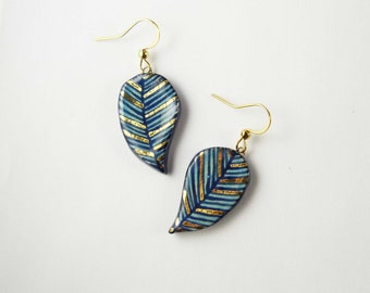 Ceramic earrings turquoise black blue leaves with gold.