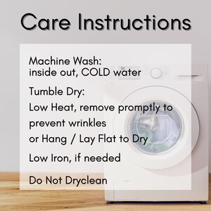 May include: Image of a white washing machine with a glass door, displaying care instructions. The text reads: Machine wash inside out in cold water, tumble dry on low heat, or hang flat to dry. Low iron if needed. Do not dry clean.