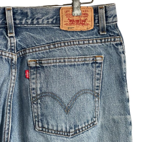 Vintage Levi's 550 Brown Tab Classic Relaxed Jeans. Faded Blue Relaxed Low-Rise Jeans. Washed Out. Casual. Street. Grunge. 80s. 1980s.