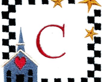 May include: Embroidered alphabet letter C with a blue church with a red heart and three gold stars in a black and white checkered frame.