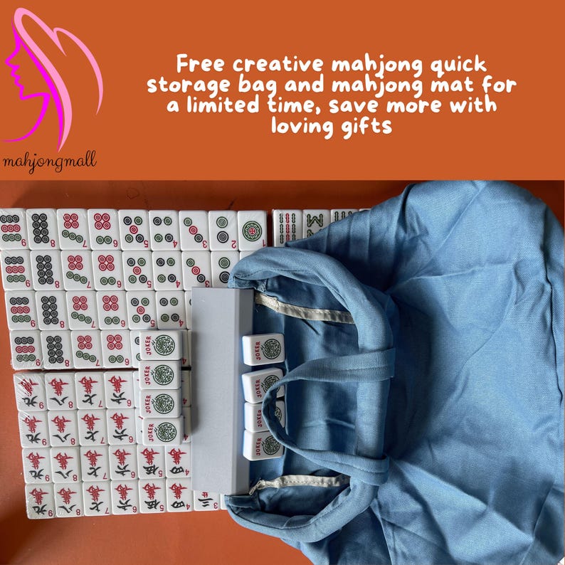 May include: A complete mahjong set with white tiles featuring red, green, and black symbols and characters. The set includes a blue storage bag and a white case. The text on the image says "Free creative mahjong quick storage bag and mahjong mat for a limited time, save more with loving gifts."