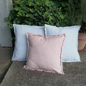 Red ticking and blue ticking pillows