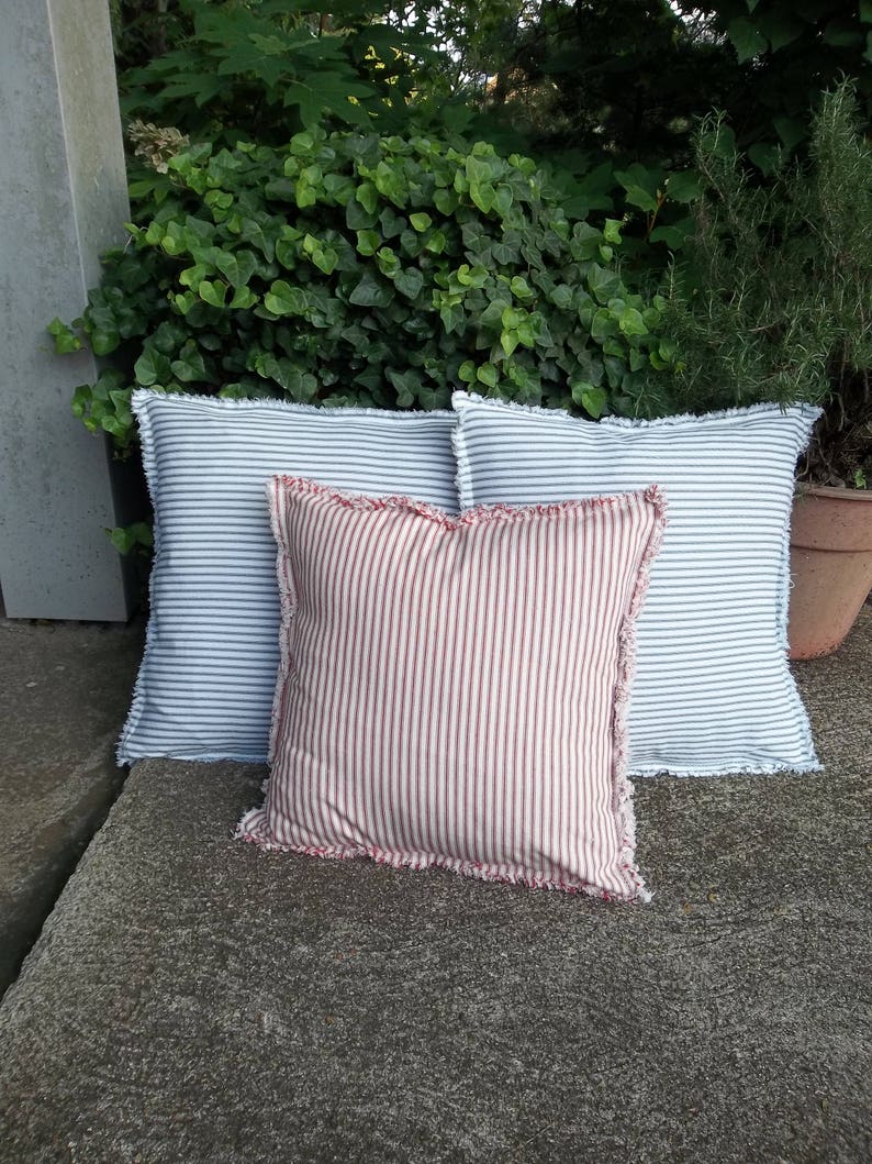 Red ticking and blue ticking pillows