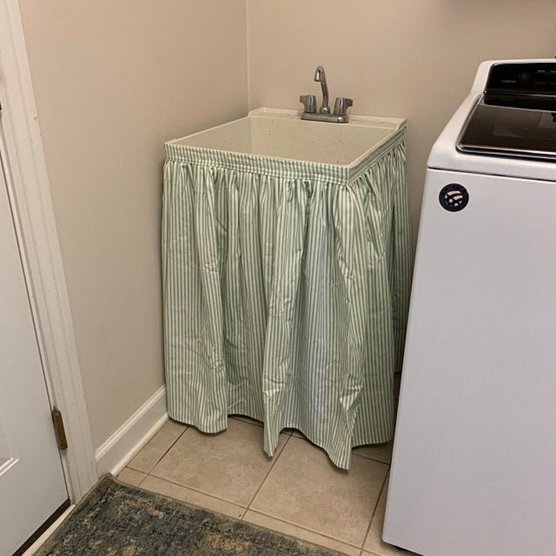 Utility sink curtain attached with Velcro