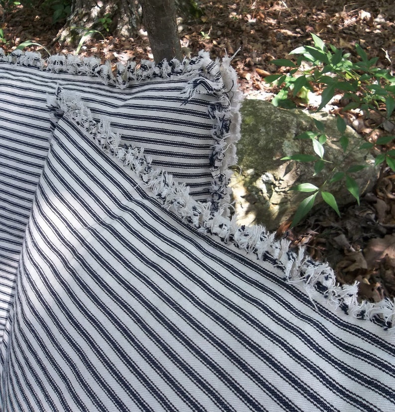 Ticking pillows with frayed edges 
Custom made