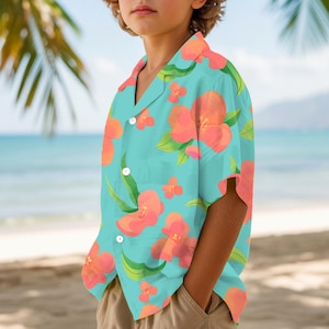May include: A turquoise Hawaiian shirt with a vibrant floral pattern in shades of coral and green. The short-sleeved shirt features a classic collar and button-down front. The shirt is worn on a beach with palm trees and ocean in the background.