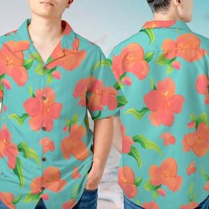 May include: A short-sleeved button-down shirt featuring a vibrant floral pattern. The shirt has a turquoise background with large orange flowers and green leaves. The shirt is made of a lightweight fabric, perfect for warm weather.