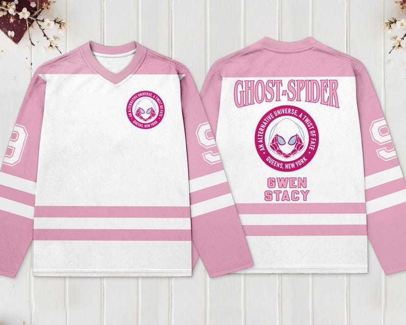 May include: Pink and white hockey jersey featuring the Ghost-Spider logo on the front and back. The jersey has pink sleeves with white stripes and the number 99. The back of the jersey reads "Ghost-Spider" and "Gwen Stacy".