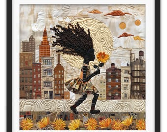 May include: A framed textile art piece featuring a dark-skinned figure with textured hair walking through a city landscape. The figure wears a patterned dress and holds a yellow flower. The background includes quilted buildings, a large moon, and orange flowers.