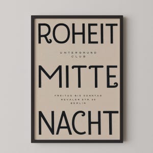 May include: A framed poster with a beige background and black text. The text reads ROHEIT, UNTERGRUND CLUB, MITTE, FREITAG BIS SONNTAG, REVALER STR. 99, BERLIN, and NACHT. The poster is enclosed in a thin black frame, presenting a clean, graphic design.