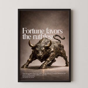 May include: A framed print featuring a bronze bull statue in a charging stance. The text "Fortune favors the ruthless" is displayed above the bull. Below, additional text discusses market losses. The artwork has a dark, neutral color palette.