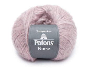 May include: A skein of Patons Norse yarn in a light pink color. The yarn is soft and fluffy, and the label says "Yarninspirations Patons Norse".
