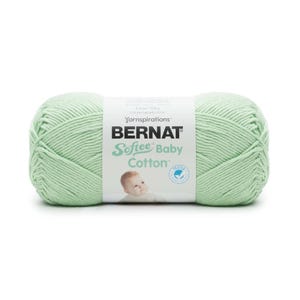 May include: A skein of Bernat Softee Baby Cotton yarn in a light green color. The yarn is 4.2 oz (120 g) and 214 yards (196 m). The label says "Yarninspirations" and "Tested".