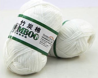 May include: Two skeins of white bamboo yarn with a green label that reads "Golden Sun Bamboo" in English and Chinese characters.
