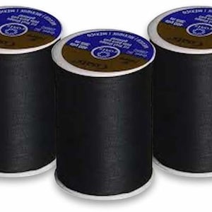 May include: Three spools of black thread, each with a white label that says "COATS" in blue lettering.