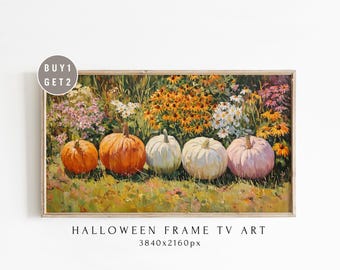 May include: A framed painting featuring five pumpkins in a row, each with a different color: orange, white, and pink. The pumpkins are set in a field of colorful flowers. The text "HALLOWEEN FRAME TV ART" is at the bottom.