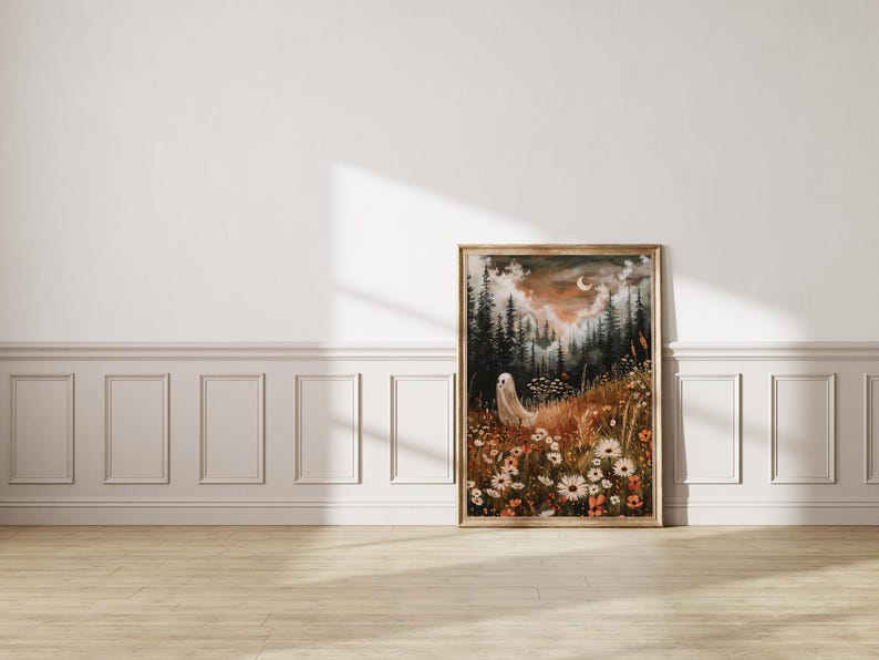 May include: A framed painting of a white ghost standing in a field of flowers. The background is a dark forest with a crescent moon in the sky. The painting has a vintage, ethereal feel.