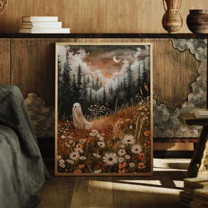 May include: A framed illustration of a white ghost standing in a field of wildflowers. The background is a dark forest with a crescent moon in the sky.