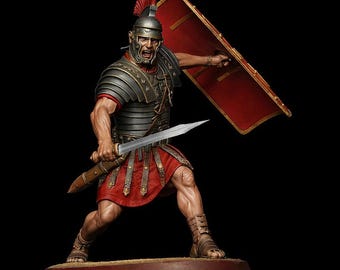 May include: A detailed figurine of a Roman soldier in full armor, holding a sword and shield. The soldier wears a helmet with a red plume, a red tunic, and leather sandals. The shield is red with a gold border. The figure is on a brown base.