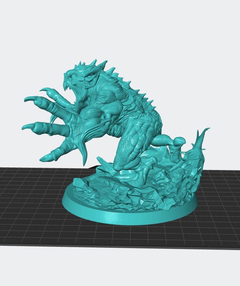 May include: A teal-colored monster figurine with sharp claws and teeth, perched atop a textured base. The creature has a detailed, scaly texture and an open-mouthed expression, suggesting a menacing pose. The base is round and has a rocky appearance.