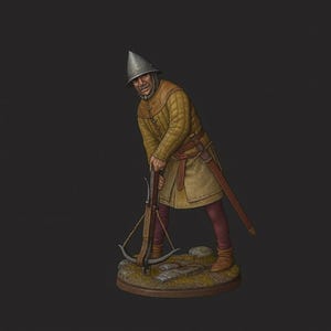 May include: A miniature figurine of a medieval soldier in a yellow tunic and helmet, holding a crossbow. The figure is posed on a small, rocky base, with a sword at his side. The background is a solid, dark gray.