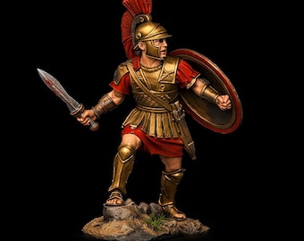 May include: A miniature figurine of a Roman soldier in full armor, holding a sword and shield. The soldier wears a gold helmet with a red plume, gold chest armor, and red tunic. The shield is red and gold.