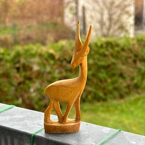 Wooden figurine of a deer. Wooden animal Sculpture Deer hand carved statuette Vintage Wild Animal figure Home decorative Deer figure