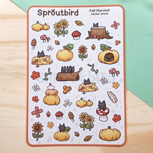 May include: A sticker sheet with a fall harvest theme featuring black cats, pumpkins, mushrooms, and leaves. The sheet is titled "Sproutbird Fall Harvest sticker sheet".