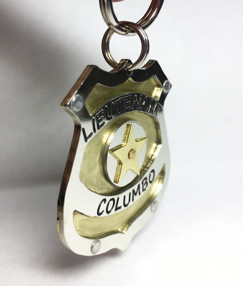 Unique Police Badge pet tag. Custom engraved metal dog law enforcement collar tag. Personalized pet id in nickel silver and brass. All hand cut, riveted and engraved in 5 sizes