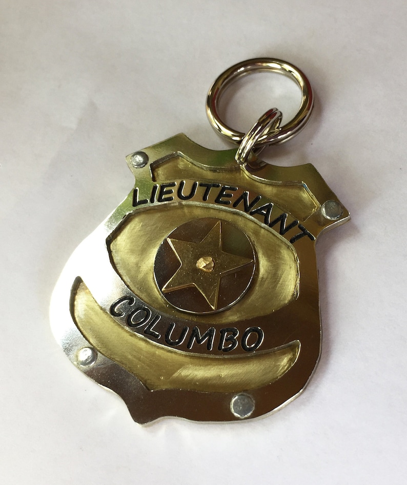 Unique Police Badge pet tag. Custom engraved metal dog law enforcement collar tag. Personalized pet id in nickel silver and brass. All hand cut, riveted and engraved in 5 sizes.