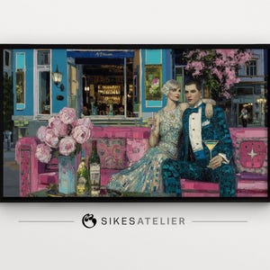 May include: A framed art print depicts a couple in elegant attire, seated on a pink sofa in front of a cafe. The artwork features a vibrant color palette, including blues, pinks, and greens, with bottles and flowers adding detail. The print is signed by SIKESATELIER.