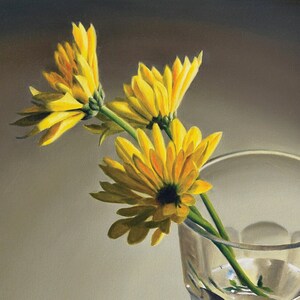 May include: A still life painting of three yellow flowers in a clear glass with a textured surface. The flowers are arranged in a vase on a light brown surface. The painting is signed "Nance Dorfman" in the lower right corner.