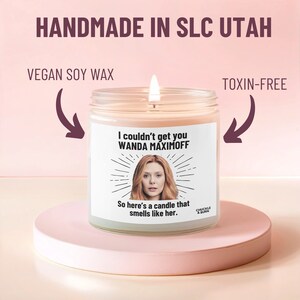 a candle with a picture of a woman on it