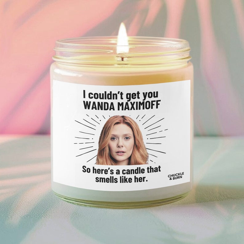 a candle with a picture of a woman on it