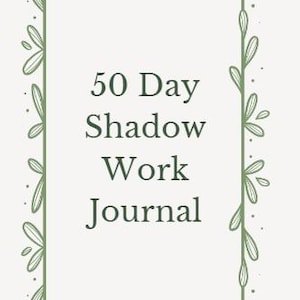 May include: A journal with the text "50 Day Shadow Work Journal" in a serif font. The text is centered within a rectangular frame, which is decorated with green leaf and vine designs. The background is a light cream color.