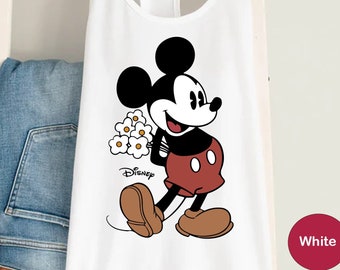 May include: White tank top with a cartoon image of Mickey Mouse holding a bouquet of flowers. The text "Disney" is printed below the image.