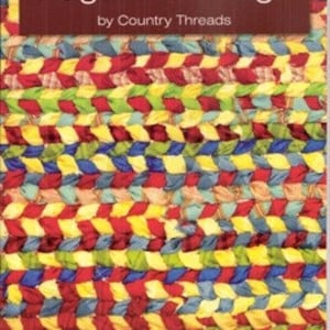 Könnte beinhalten: Buchcover für "Rugs From Rags" von Country Threads, 3. Auflage. Das Cover zeigt einen bunten geflochtenen Teppich aus Stoffresten.