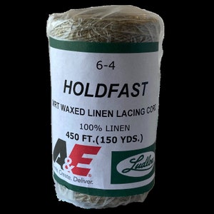 May include: A spool of Holdfast waxed linen lacing cord. The label reads "6-4", "MRT Waxed Linen Lacing Cord", and "100% Linen, 450 ft. (150 yds.)". The A&E logo is visible. The cord is wrapped in clear plastic.