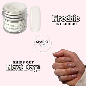 May include: White dip powder in a clear jar with a white label that says "SPARKLE & CO. dip powder". A small sample of the powder is shown next to the jar. The image also includes a hand with white glitter nail polish and a logo that says "SPARKLE & CO.". The text "Freebie INCLUDED!" and "SHIPS OUT Next Day!" is also included in the image.