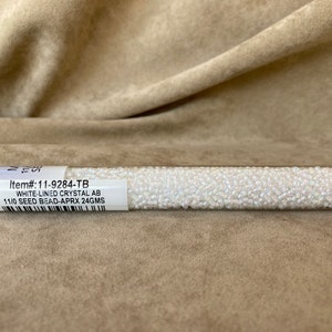 11-284, Miyuki 22g White Lined Crystal AB 11-284, Miyuki 22g White Lined Crystal AB