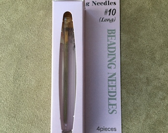 May include: A pack of four Tulip Beading Needles in size #10 (Long). The needles are packaged in a clear plastic tube with a purple label. The label says "Tulip Beading Needles" and "4 pieces".