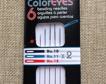 May include: A package of six ColorEyes beading needles from The Beadsmith. The package includes three sizes of needles: size 10, size 11 (two needles), and size 12.